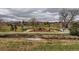 Scenic park features a playground, a pavilion, seating areas, and a creek running through it at 3706 E Easter Dr, Centennial, CO 80122