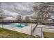 Outdoor community pool, partially covered for year-round enjoyment, plus a deck with seating at 3706 E Easter Dr, Centennial, CO 80122