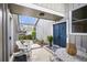 Inviting entryway with double doors, stone pavers, patio furniture, and pergola at 3706 E Easter Dr, Centennial, CO 80122