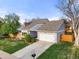Attractive gray home showcasing well-maintained landscaping, a spacious driveway, and a two-car garage at 3706 E Easter Dr, Centennial, CO 80122