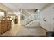 Foyer with hardwood flooring, white staircase, and an antique wooden console table at 3706 E Easter Dr, Centennial, CO 80122