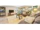 A cozy living room showcasing a comfortable sofa, stylish decor, and natural light streaming through the windows to enhance the ambiance at 3706 E Easter Dr, Centennial, CO 80122