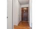 Hallway with hardwood floors, closet, and front door at 755 S Alton Way # 8D, Denver, CO 80247