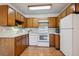 Well-lit kitchen featuring essential appliances and countertop space, perfect for meal prep at 755 S Alton Way # 8D, Denver, CO 80247