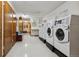 Community laundry room with several washers and dryers, plus some seating at 755 S Alton Way # 8D, Denver, CO 80247