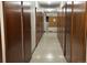 Hallway view of storage area with multiple wood-paneled storage doors on either side of the hall at 755 S Alton Way # 8D, Denver, CO 80247