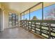 Enclosed sunroom featuring geometric block details, tiled floor and large windows with views of the exterior at 755 S Alton Way # 8D, Denver, CO 80247
