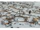 Aerial view of house and neighborhood in winter at 1466 Elmwood Ln, Denver, CO 80221