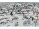 Aerial view of house and neighborhood in winter at 1466 Elmwood Ln, Denver, CO 80221