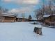 Large backyard with snow, shed, and trampoline at 1466 Elmwood Ln, Denver, CO 80221