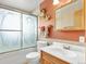 Clean bathroom with updated vanity and shower/tub combo at 1466 Elmwood Ln, Denver, CO 80221