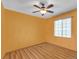 Bright bedroom with ceiling fan and wood-look floors at 1466 Elmwood Ln, Denver, CO 80221