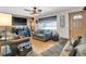 Living room with hardwood floors, two sofas, and a ceiling fan at 1466 Elmwood Ln, Denver, CO 80221