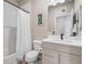 Full bathroom featuring a shower with white subway tile, and a light gray vanity at 10105 Morrison Rd, Lakewood, CO 80227