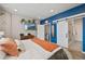 Comfortable bedroom with attached bathroom, barn doors, and a scenic view at 10105 Morrison Rd, Lakewood, CO 80227