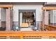 Covered patio offering a view into the home's modern interior, complete with outdoor seating at 10105 Morrison Rd, Lakewood, CO 80227
