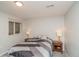 Cozy bedroom with a comfortable queen-sized bed and bedside tables with lamps for a relaxing ambiance at 155 Xenon St # 33, Denver, CO 80228