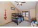 Bright bedroom with a bunk bed, carpeted floors, and a ceiling fan at 155 Xenon St # 33, Denver, CO 80228