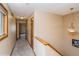 Hallway features carpet flooring, neutral paint, a pendant light fixture, and a window with natural lighting at 155 Xenon St # 33, Denver, CO 80228