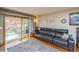 Inviting living room with hardwood floors, slider to backyard and a comfortable sofa at 155 Xenon St # 33, Denver, CO 80228