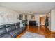 Bright living room with hardwood floors, comfortable sofa, and stylish decor accents at 155 Xenon St # 33, Denver, CO 80228