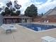 Enjoy a refreshing swim in the community pool with ample lounge chairs and shaded seating areas for relaxation at 155 Xenon St # 33, Denver, CO 80228