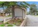 Welcome to Lakewood Hills, beautifully landscaped entrance with stone signage and flourishing garden bed at 155 Xenon St # 33, Denver, CO 80228