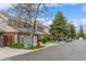 Charming townhomes line a quiet street with mature trees and well-maintained lawns, offering a serene community setting at 155 Xenon St # 33, Denver, CO 80228