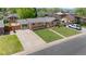 Aerial view featuring the home's front yard, driveway, and well-maintained lawn at 1195 S Kendall St, Lakewood, CO 80232