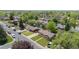 Aerial view showcasing the home's location within a mature neighborhood with tree-lined streets at 1195 S Kendall St, Lakewood, CO 80232