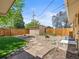 Spacious backyard featuring a shed, fire pit, and ample space for outdoor activities at 1195 S Kendall St, Lakewood, CO 80232