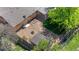 Aerial view of the backyard with a fire pit, garden shed, and patio area at 1195 S Kendall St, Lakewood, CO 80232