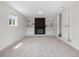 A finished basement with carpet, window, and fireplace at 1195 S Kendall St, Lakewood, CO 80232