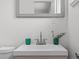 Close-up of a stylish sink and vanity in a neutral colored bathroom at 1195 S Kendall St, Lakewood, CO 80232