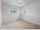 A bedroom with carpet and windows at 1195 S Kendall St, Lakewood, CO 80232