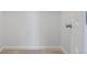 A bedroom closet with a door and neutral carpet at 1195 S Kendall St, Lakewood, CO 80232