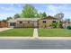 Charming home with a well-manicured lawn and inviting curb appeal at 1195 S Kendall St, Lakewood, CO 80232