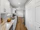 Well-lit kitchen with stainless steel appliances, granite countertops, and abundant storage space at 1195 S Kendall St, Lakewood, CO 80232