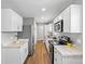 Modern kitchen featuring granite countertops, stainless steel appliances, and ample cabinet space at 1195 S Kendall St, Lakewood, CO 80232