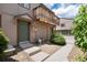 Inviting entrance featuring front door, landscaping, walkway and stairs leading up to the home at 7700 W Glasgow Pl # 24C, Littleton, CO 80128