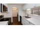 Updated kitchen featuring stainless steel appliances and white cabinets and countertops at 7700 W Glasgow Pl # 24C, Littleton, CO 80128