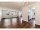 Open living area with sleek floors, bright windows, and a seamless transition to the kitchen at 7700 W Glasgow Pl # 24C, Littleton, CO 80128
