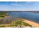 Stunning aerial view of the lake with clear blue water and lush green surroundings at 9442 W Walden Ave, Littleton, CO 80128