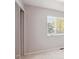 Sunlit bedroom with large window and a double-door closet at 9442 W Walden Ave, Littleton, CO 80128