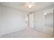 Carpeted bedroom featuring a ceiling fan and double door closet at 9442 W Walden Ave, Littleton, CO 80128
