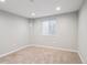 Cozy bedroom featuring neutral paint, plush carpeting, and a bright window at 9442 W Walden Ave, Littleton, CO 80128