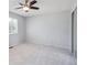 This light and airy bedroom has a large window and ceiling fan at 9442 W Walden Ave, Littleton, CO 80128