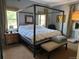 Comfortable bedroom with a four-poster bed, large window, and neutral decor for a relaxing retreat at 3098 W 39Th Ave, Denver, CO 80211