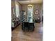 Elegant dining room with modern lighting, large dining table, and lots of light at 3098 W 39Th Ave, Denver, CO 80211