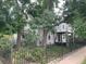 Charming two-story home featuring mature trees, a fenced yard and street access at 3098 W 39Th Ave, Denver, CO 80211
